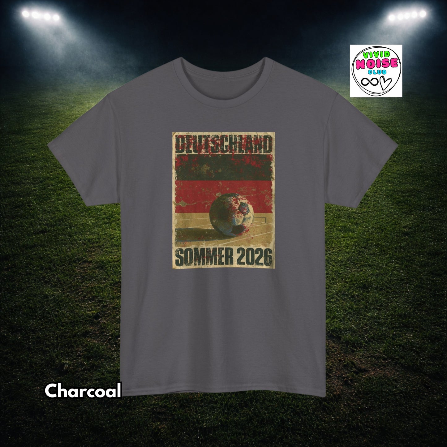 Gray t-shirt with a soccer ball graphic and text on a grass field background
