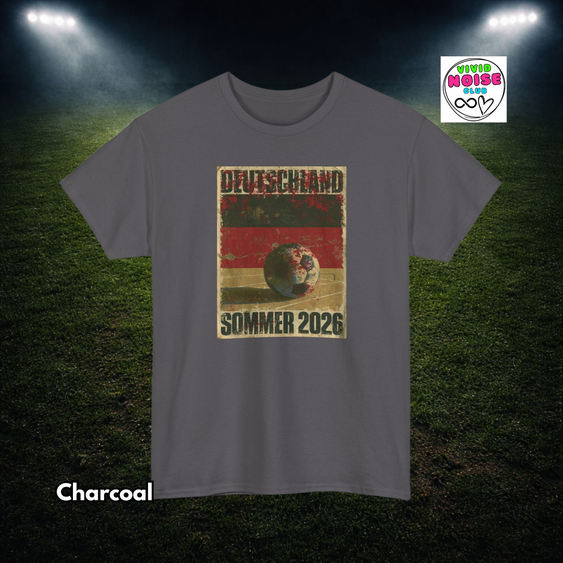 Gray t-shirt with a soccer ball graphic and text on a grass field background