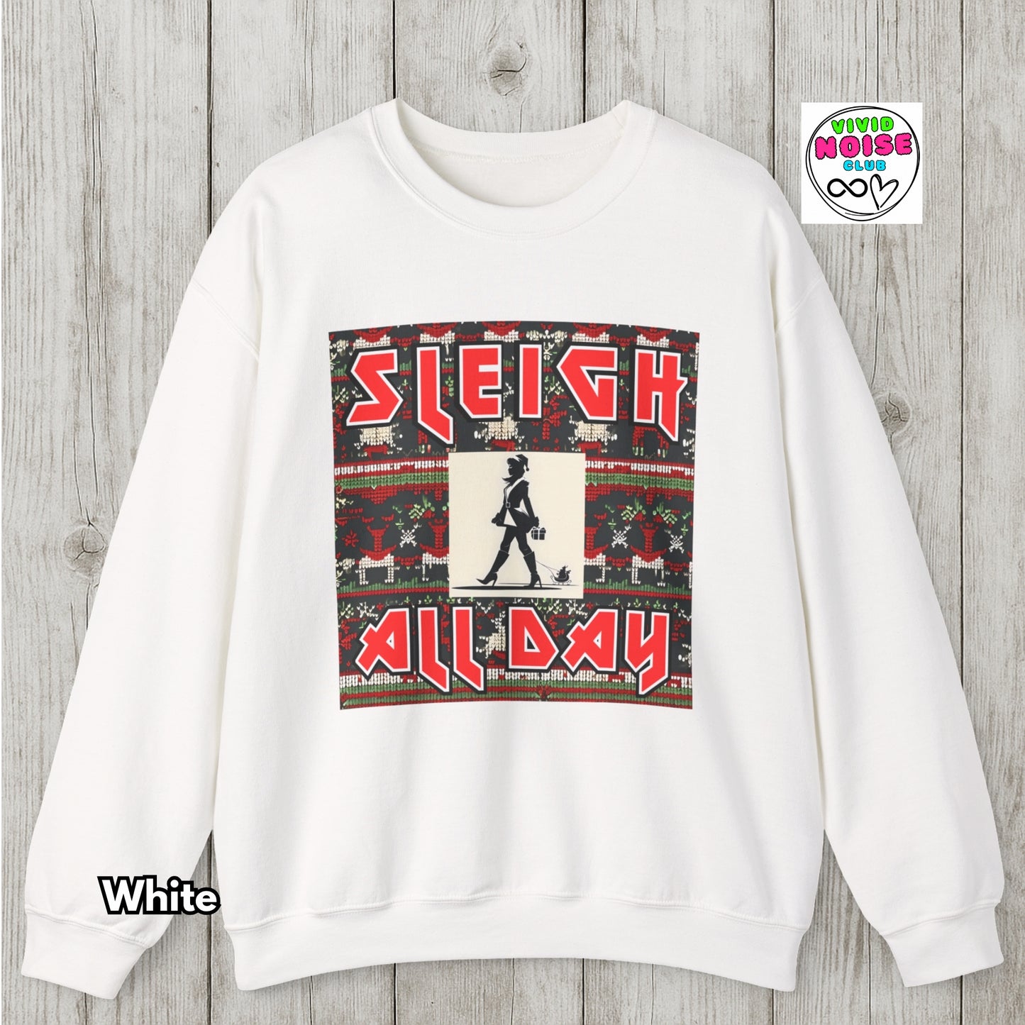 White sweatshirt with 'Sleigh All Day' graphic on a wooden surface, featuring the brand 'Viva La Noise'.