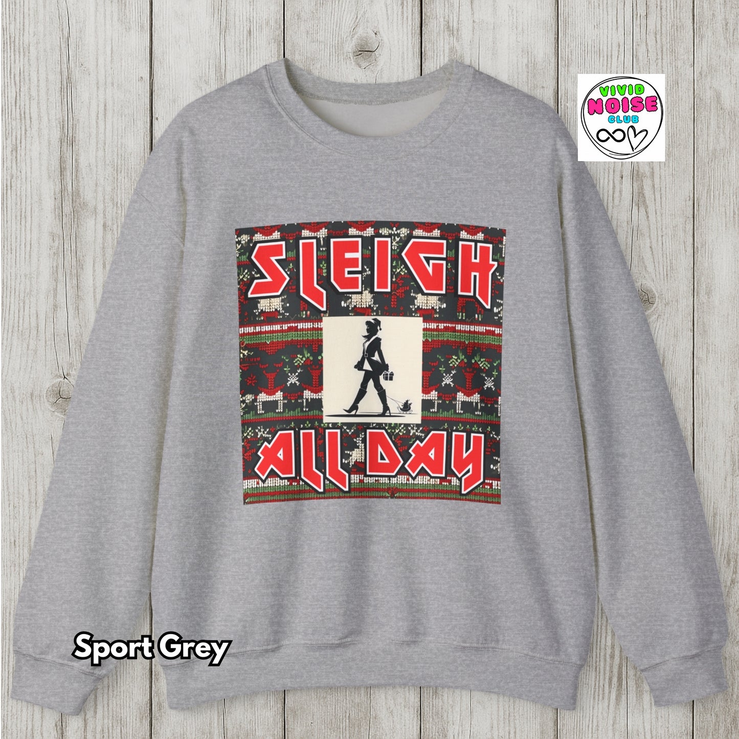 Gray sweatshirt with a festive graphic and 'Sleigh All Day' text on a wooden background