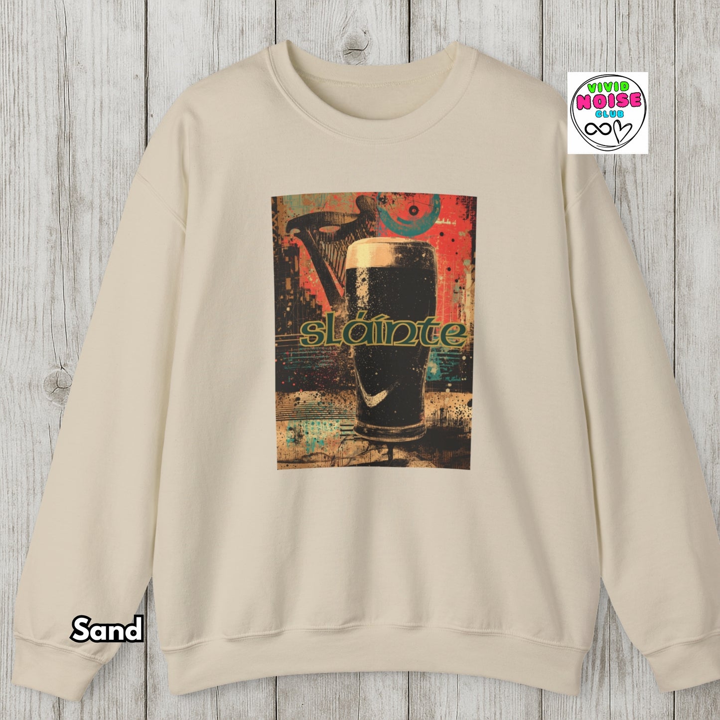 Beige sweatshirt with a graphic of a pint of stout and 'Stout' text on a wooden surface.
