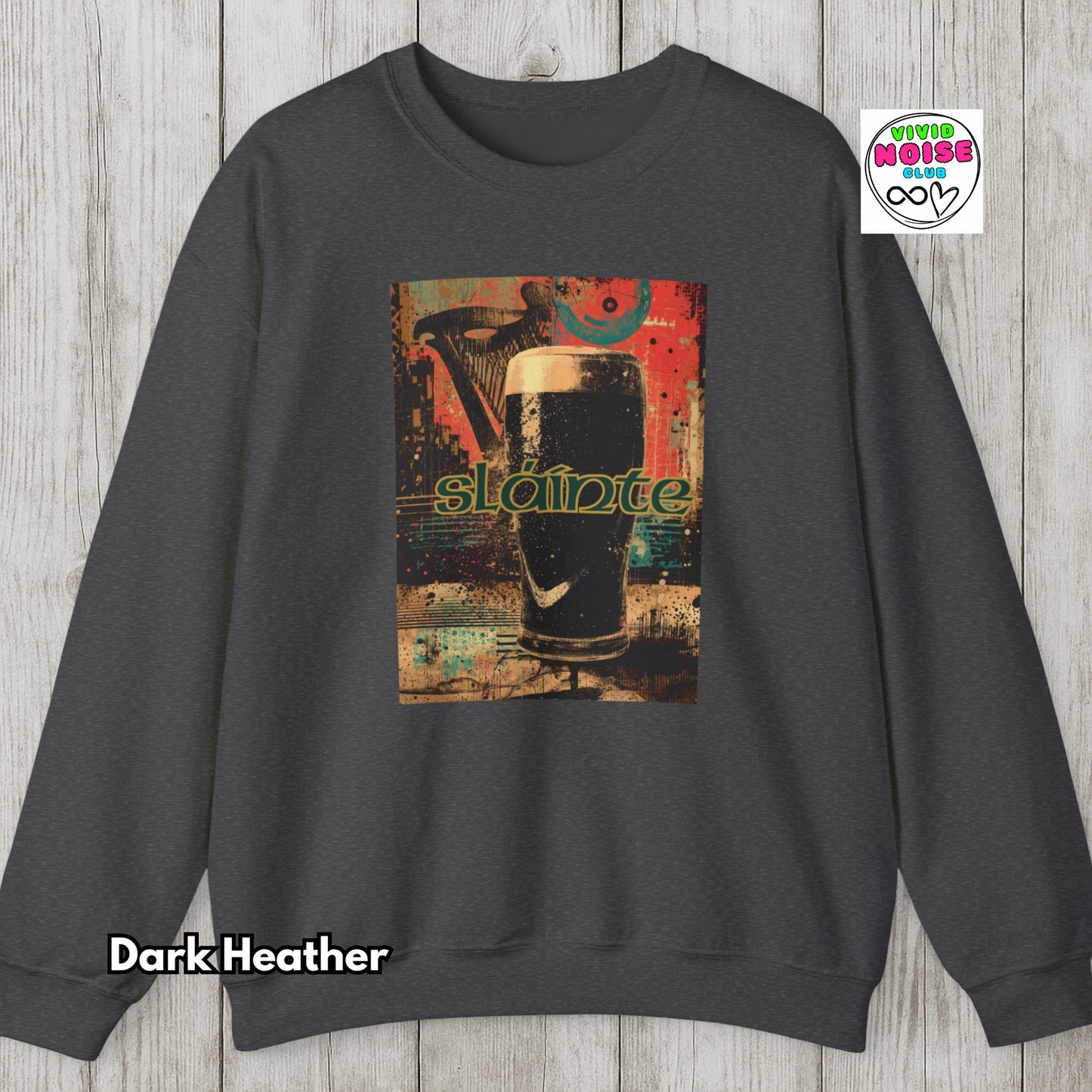 Dark Heather sweatshirt with a graphic design of a beer glass and 'slainte' text on a wooden surface.