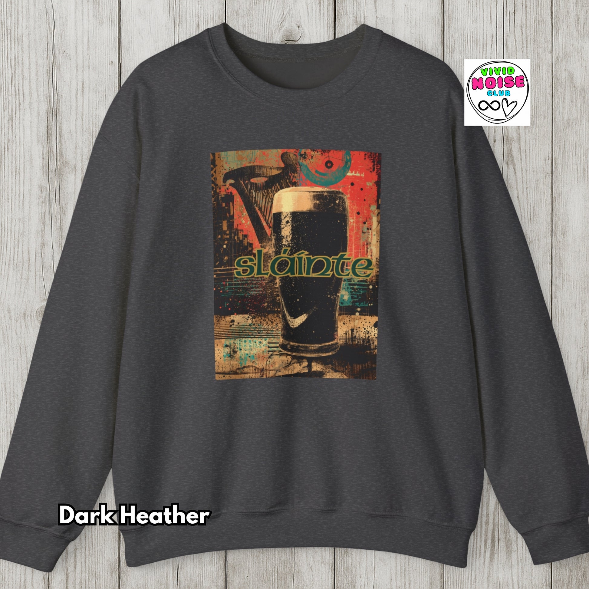 Dark Heather sweatshirt with a graphic design of a beer glass and 'slainte' text on a wooden surface.