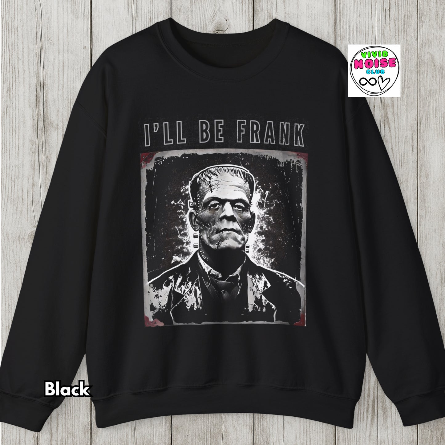 Black sweatshirt with Frankenstein graphic and 'I'll Be Frank' text on a wooden surface.