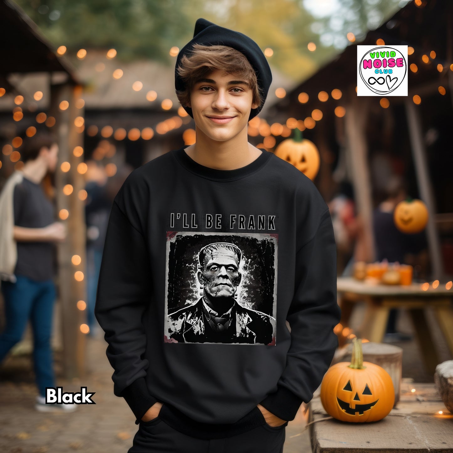 Model wearing a black Frankenstein Halloween pun sweatshirt with a bold black-and-white monster graphic.