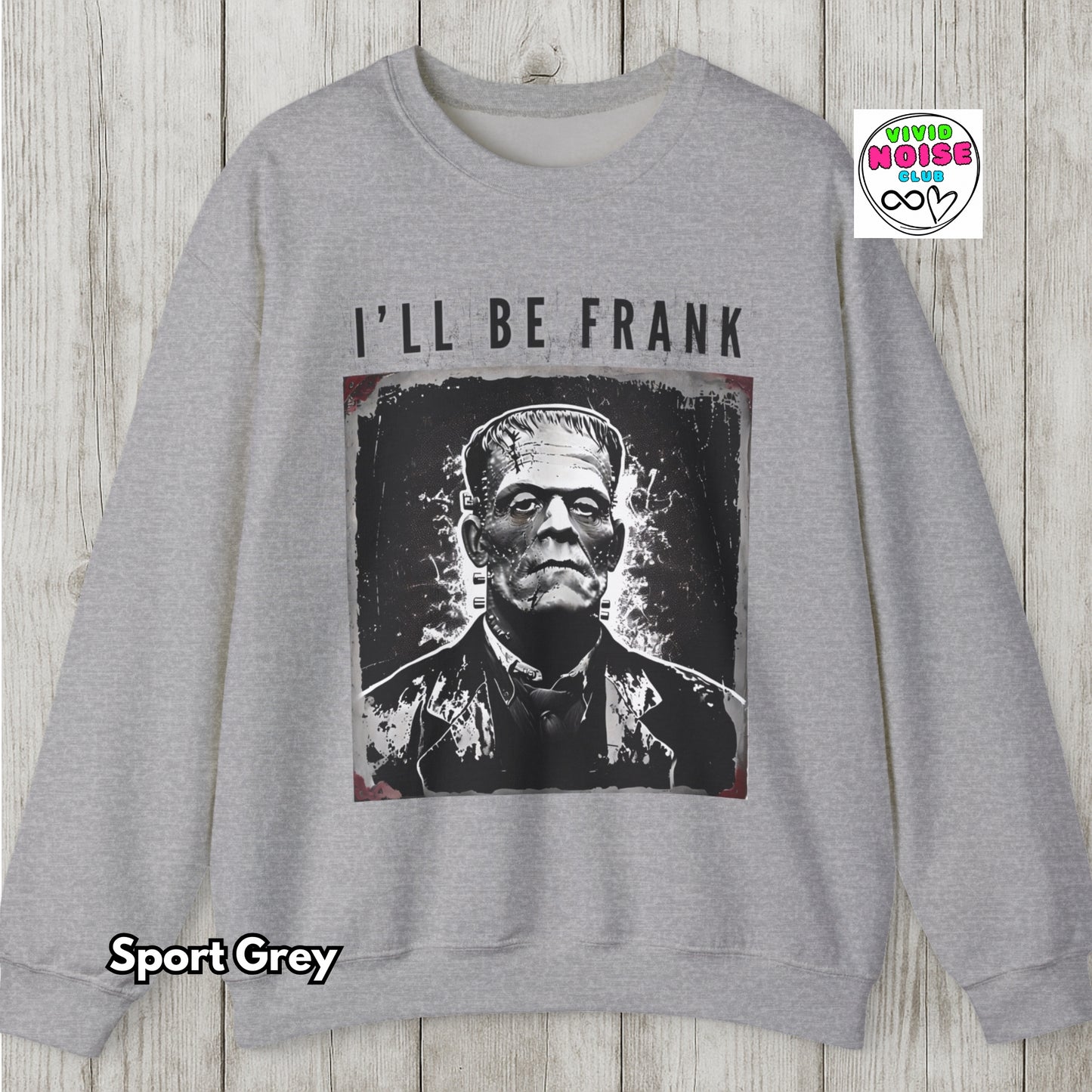 Gray sweatshirt with Frankenstein graphic and 'I'll Be Frank' text on a wooden background