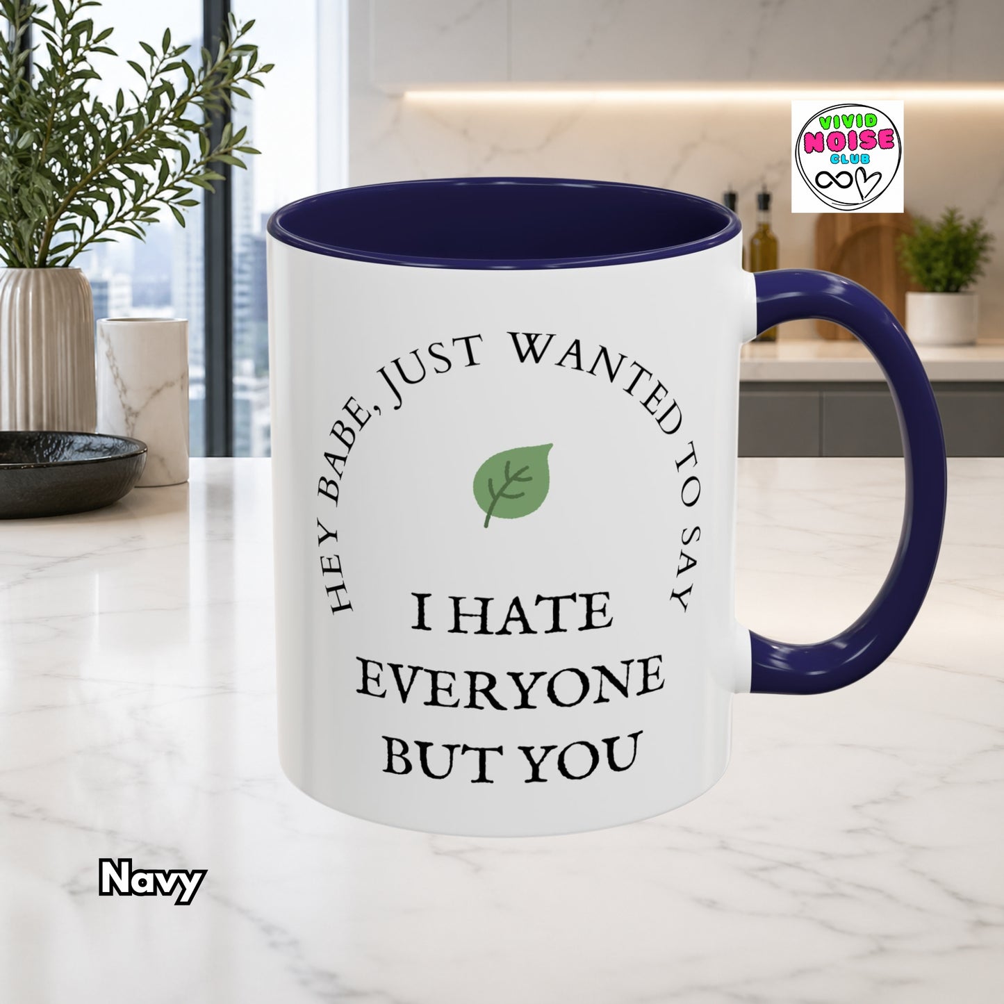 White mug with navy blue interior and handle, featuring a humorous message, on a kitchen counter.