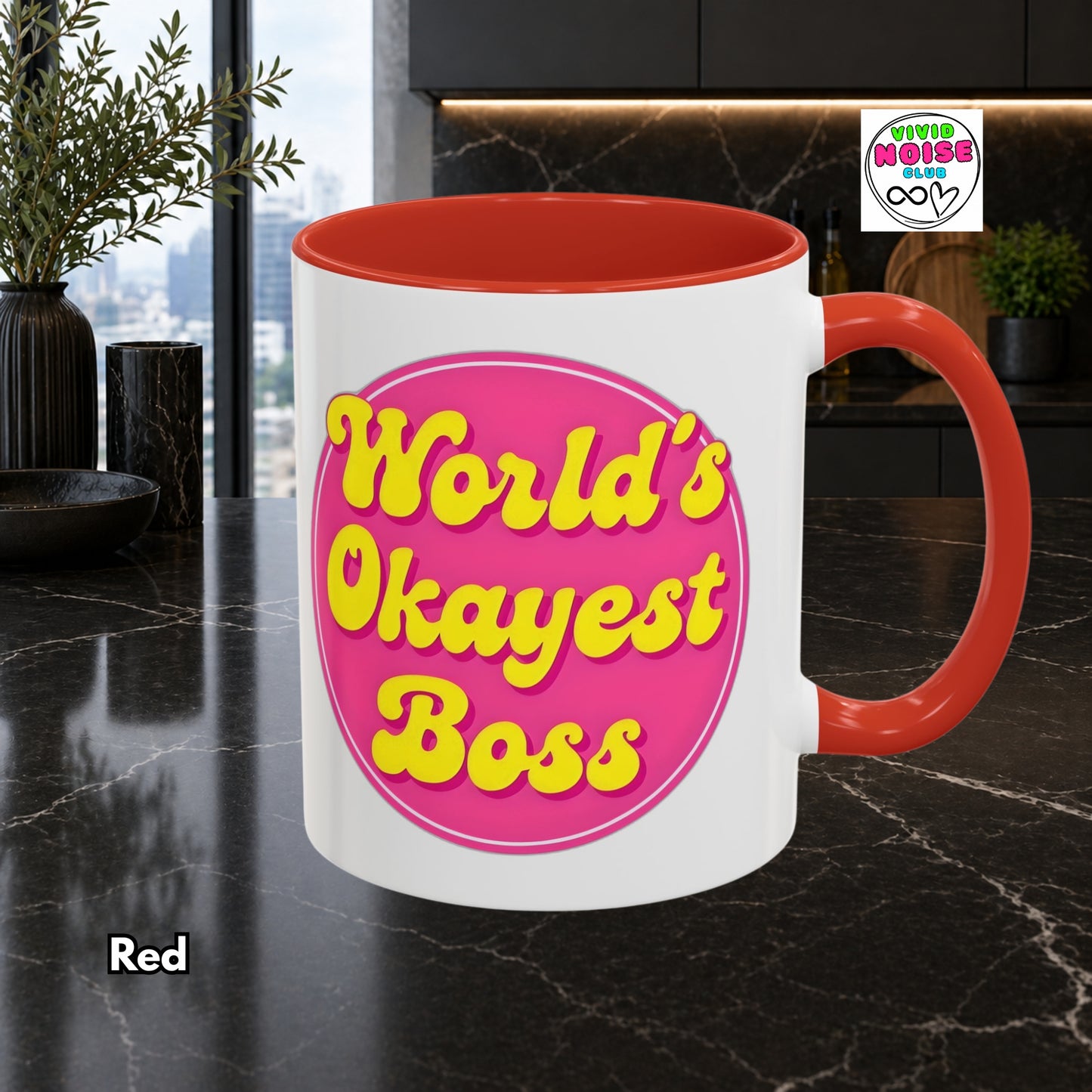 Mug with 'World's Okayest Boss' text on a kitchen counter