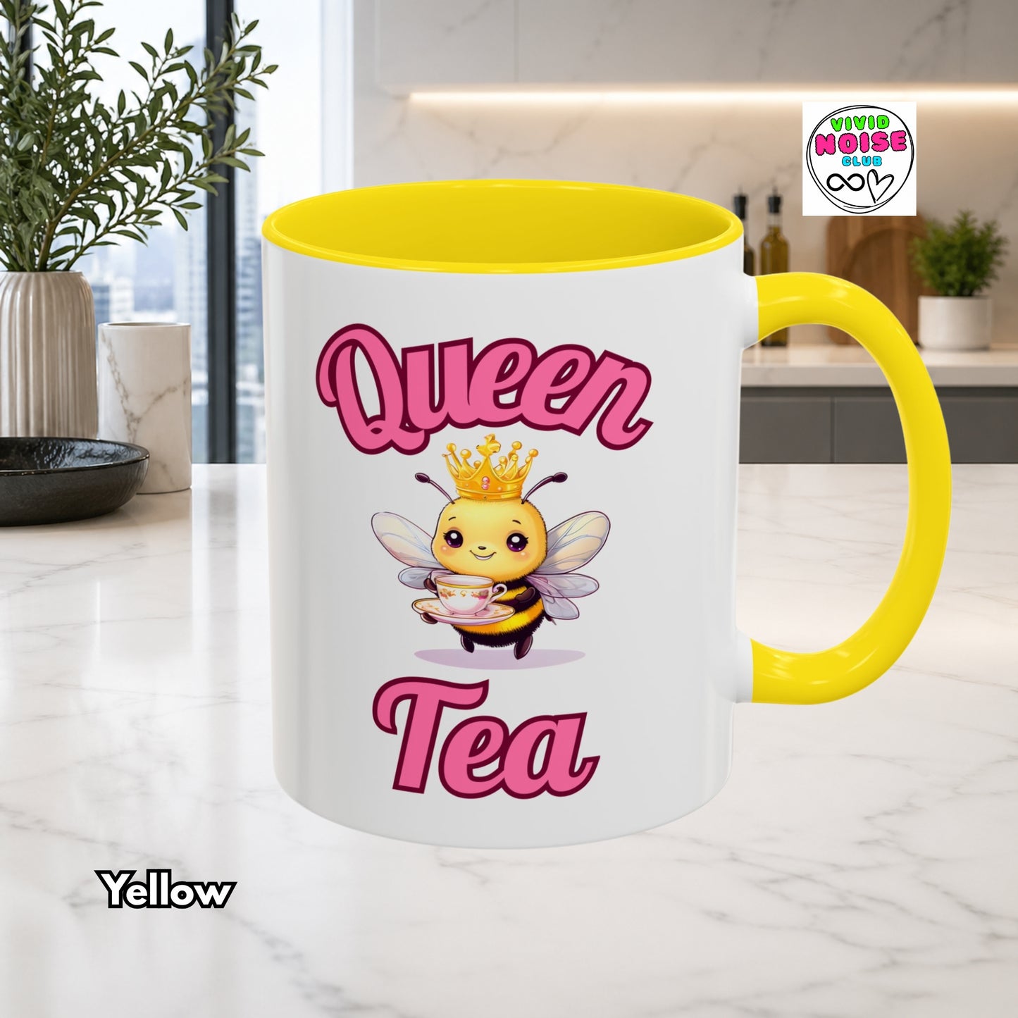 Mug with bee illustration and 'Queen Tea' text on a kitchen counter