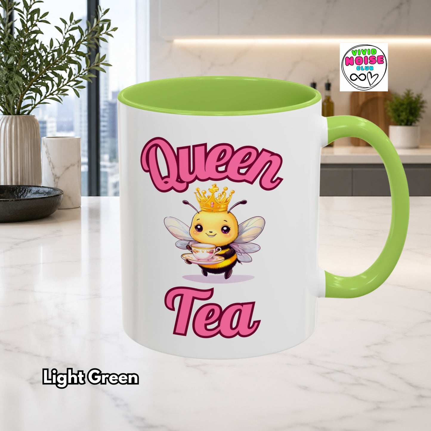 Mug with bee illustration and 'Queen Tea' text in a kitchen setting