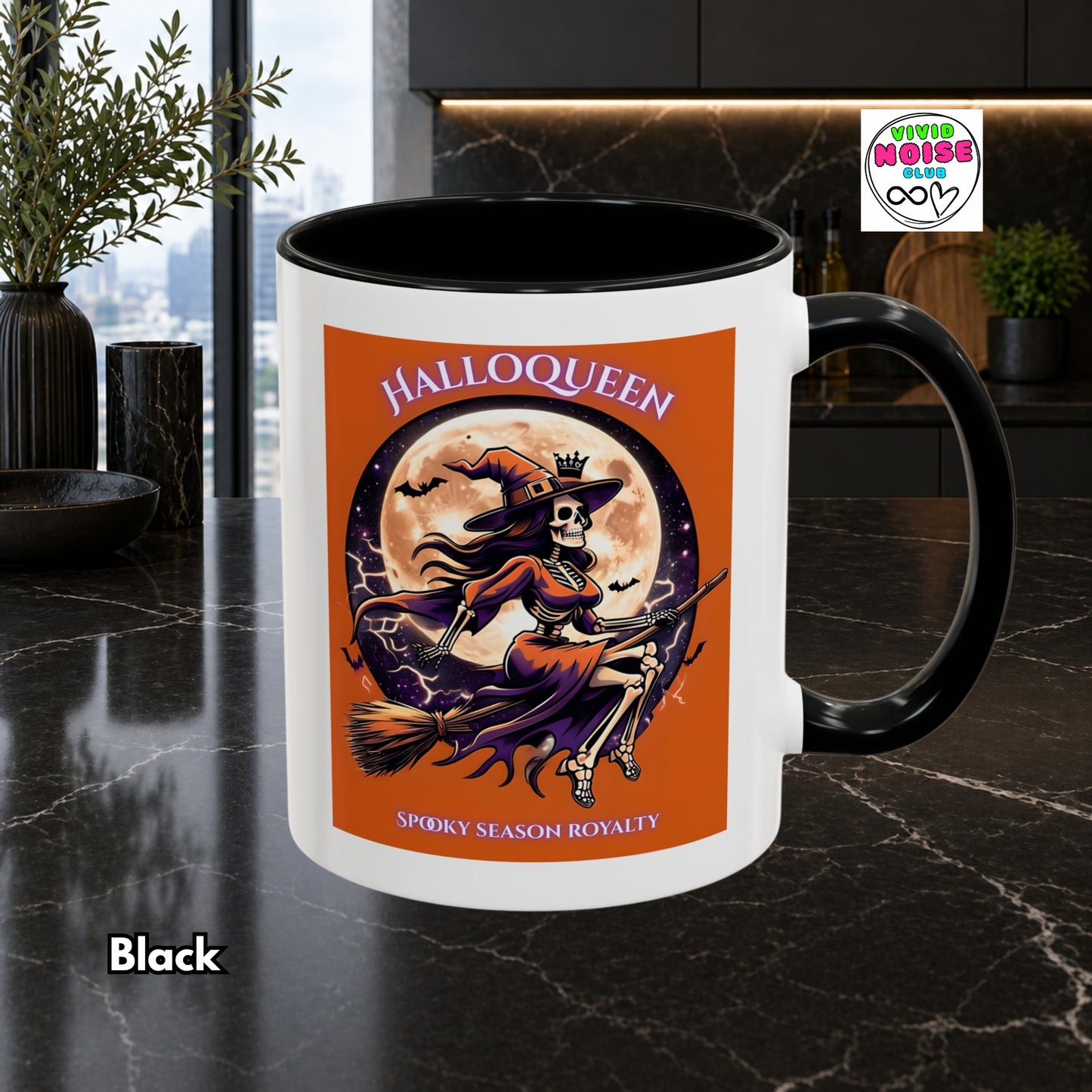Mug with Halloween-themed design featuring a witch and moon on a black countertop.