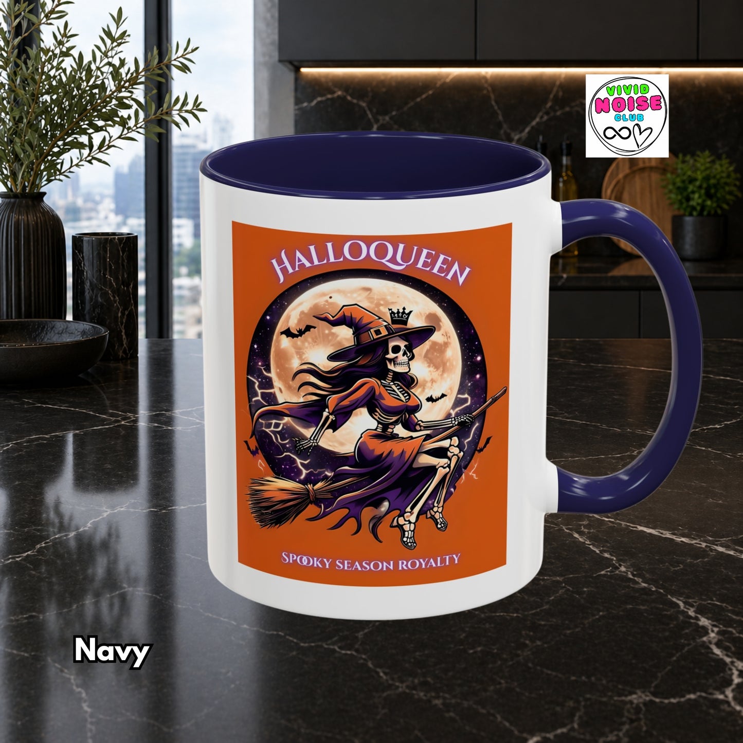 Mug with Halloween-themed design featuring a witch and skull, on a dark surface.