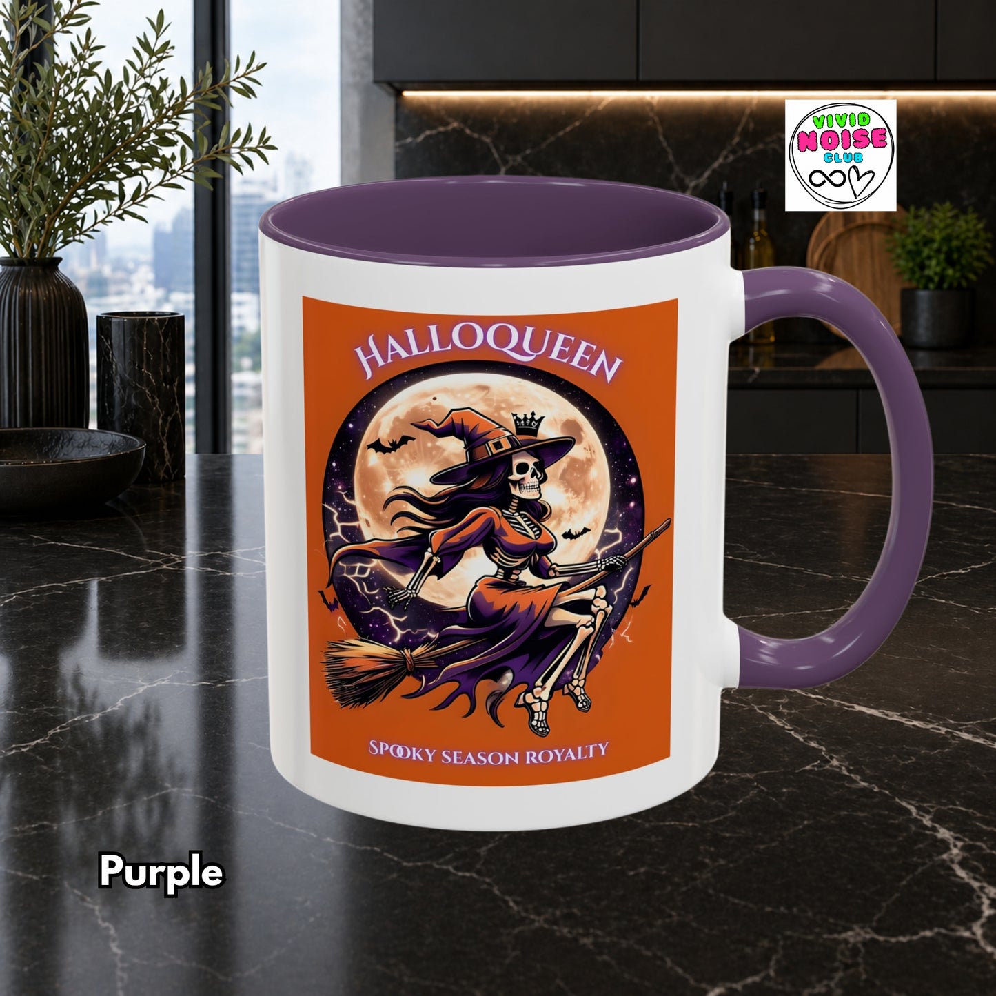 Halloween-themed mug with a purple handle on a kitchen counter
