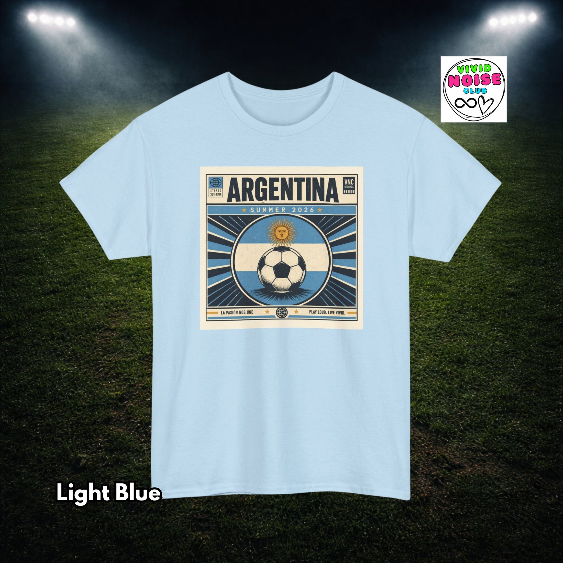 Light blue t-shirt with Argentina soccer design on a grass field background