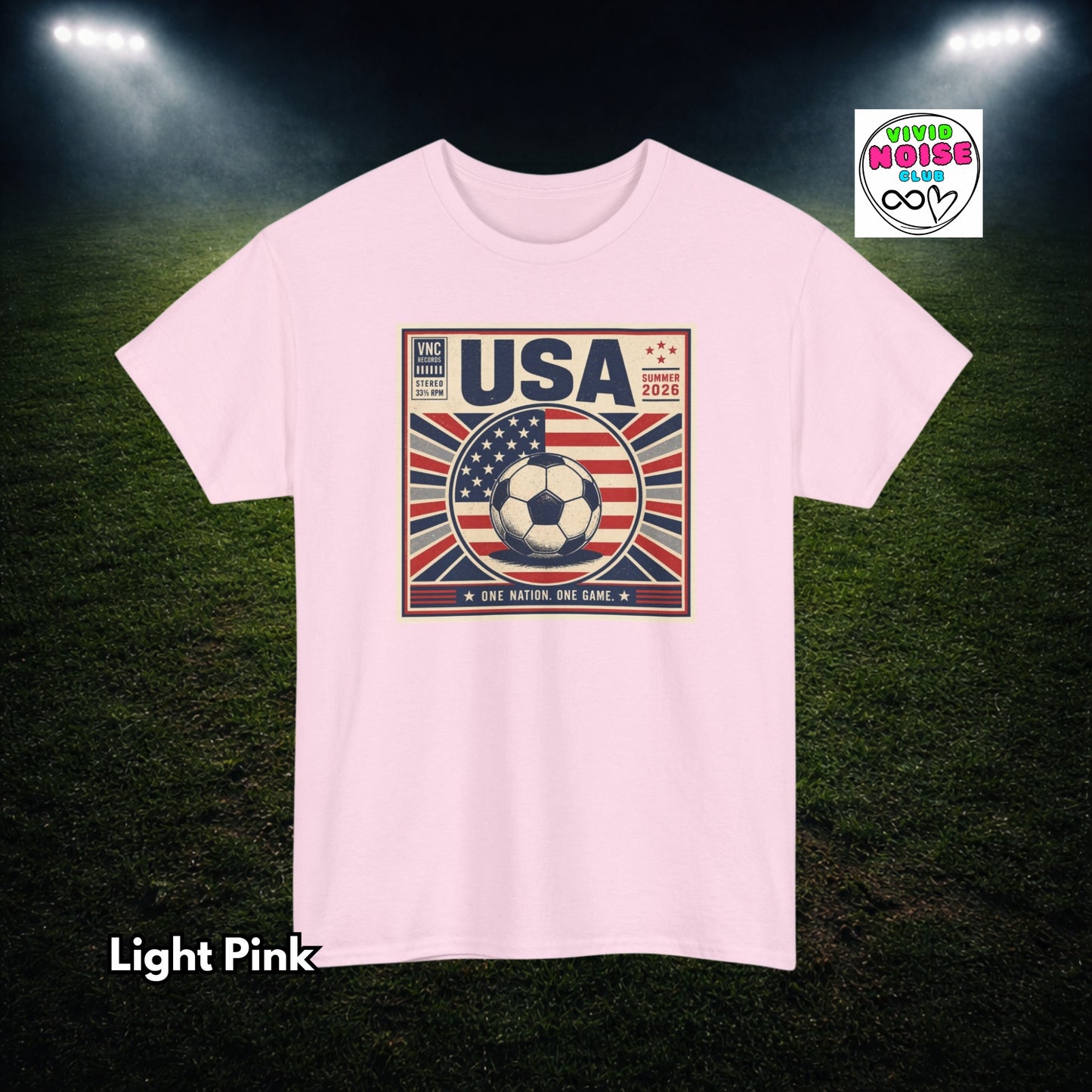 Light pink t-shirt with USA soccer design on a dark green field background