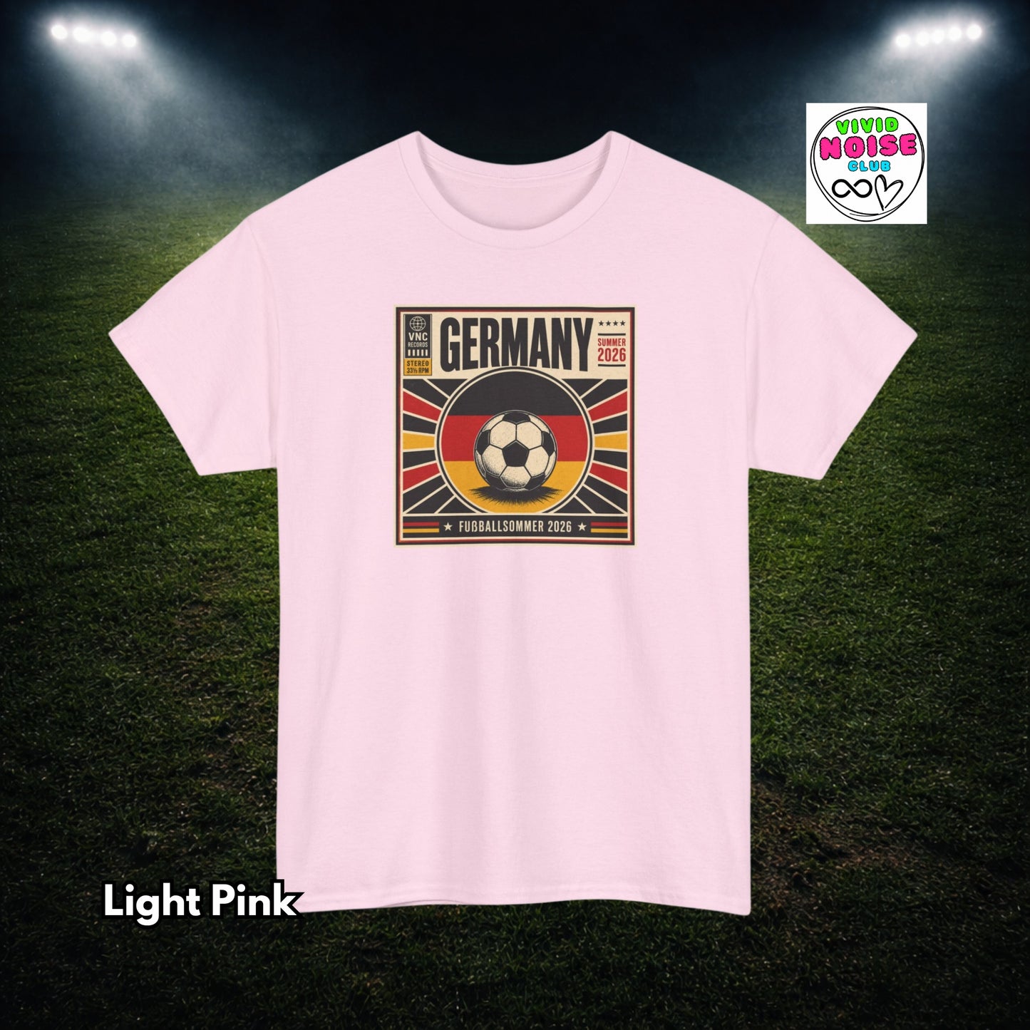 Light pink t-shirt with Germany soccer design on a dark green field background