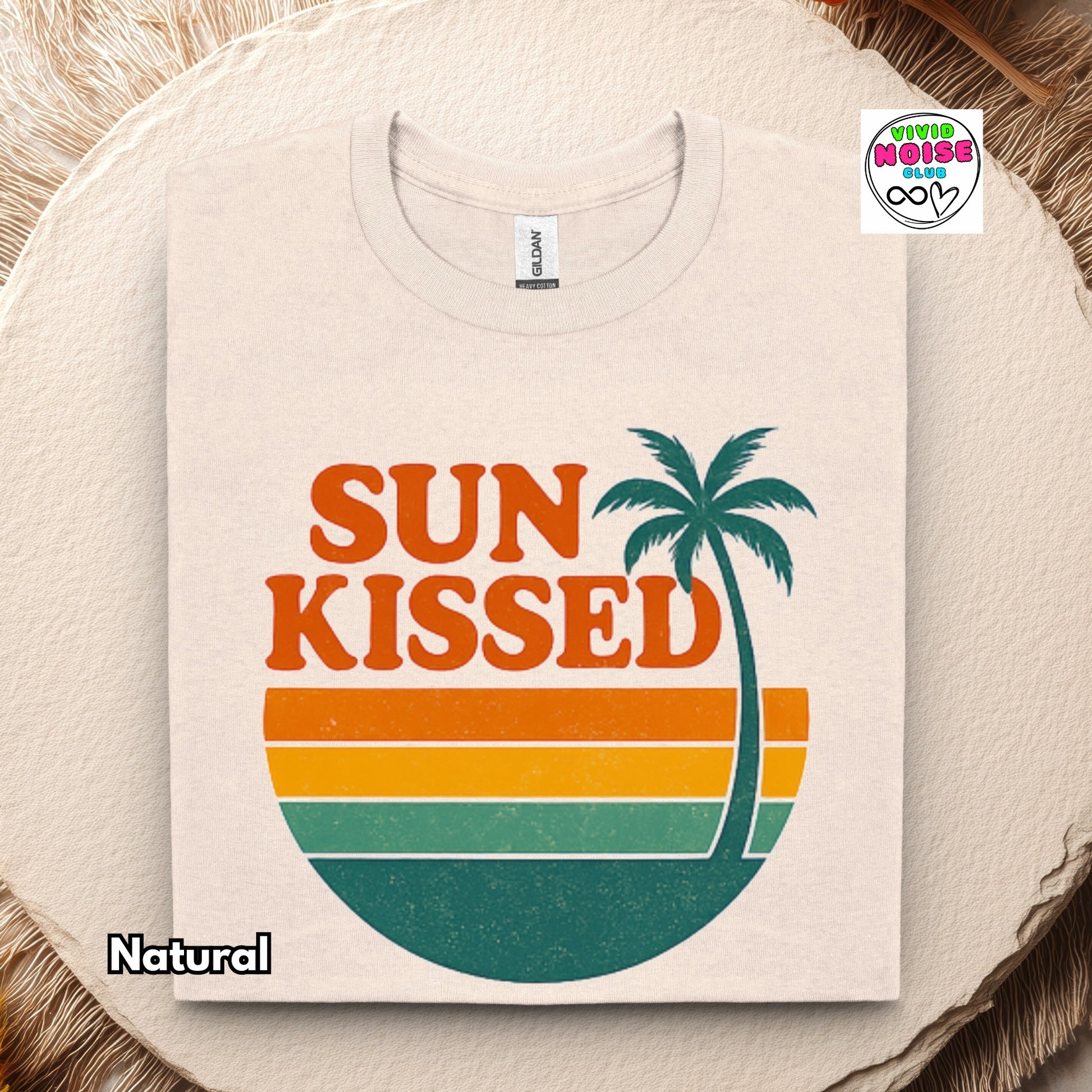 T-shirt with 'Sun Kissed' design featuring a palm tree on a beige background