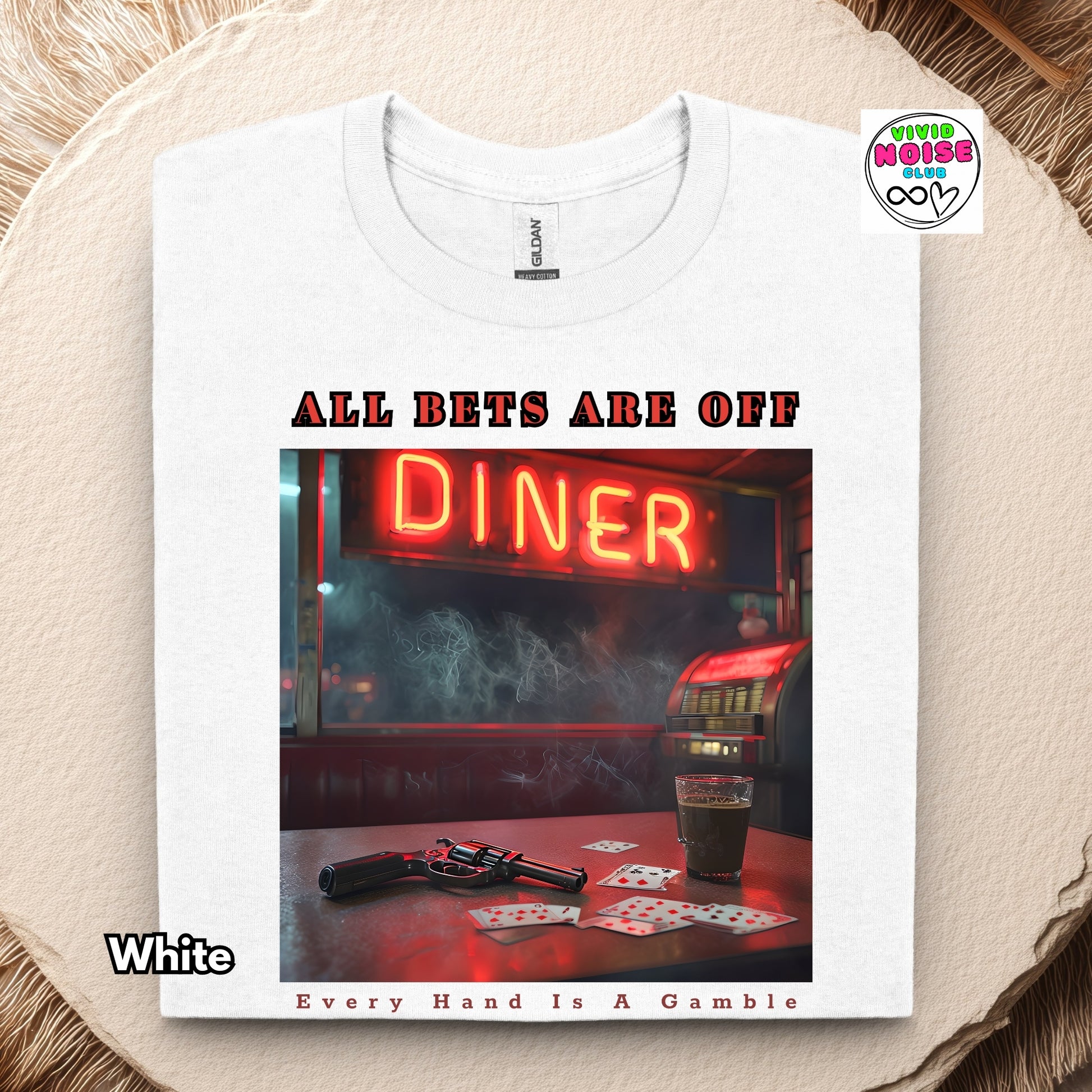 White t-shirt with a graphic design of a diner neon sign and playing cards on a textured surface.