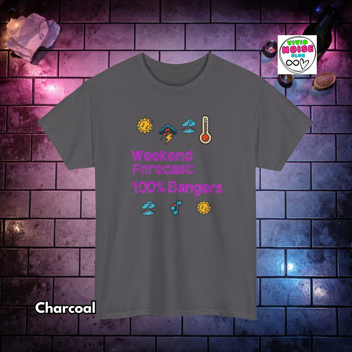 A charcoal gray t-shirt with a colorful graphic reading 'Weekend Forecast: 100% Bangers' in purple text, surrounded by weather icons. The shirt is displayed against a dark brick wall background with purple and blue lighting, with 'Charcoal' text overlay at the bottom left.