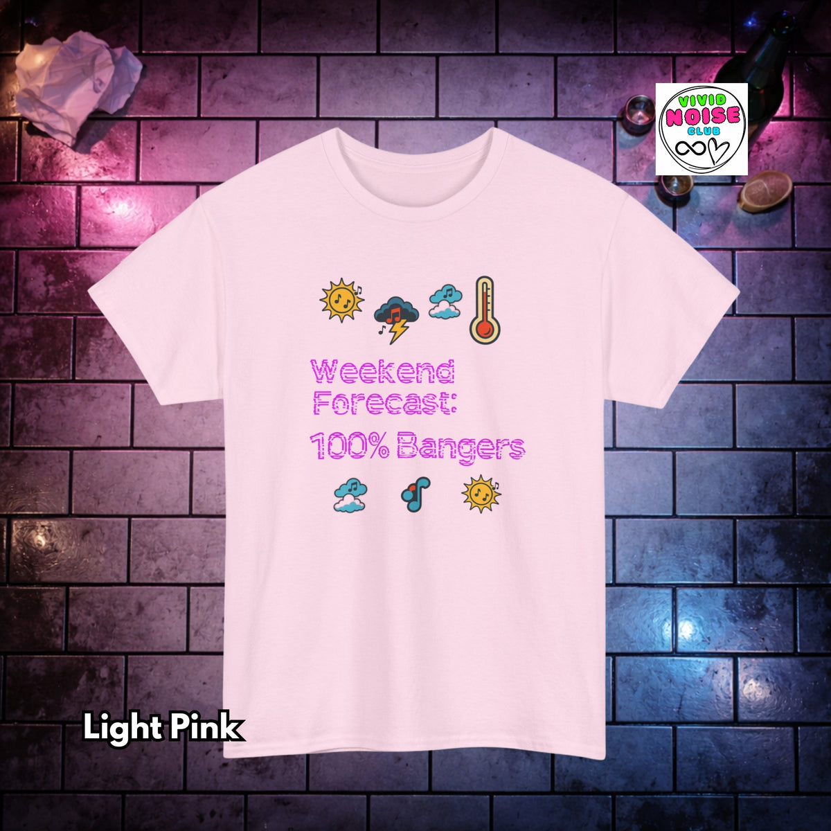 A light pink short-sleeve t-shirt with a cartoon weather graphic and the text 'Weekend Forecast: 100% Bangers' printed on the front. The shirt is displayed against a dark brick wall background with purple and blue lighting, with a 'Vivid Noise Club' logo in the top right corner.