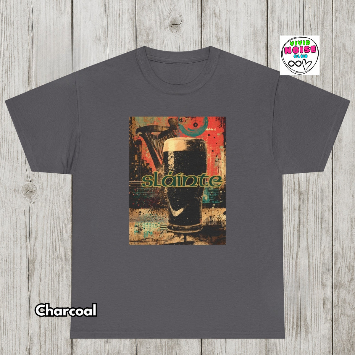 A charcoal gray t-shirt with a colorful graphic print of a pint of stout with the word 'sludge' in green, displayed on a light gray wood plank background. A 'Vivid Noise Club' logo is visible in the top right, and 'Charcoal' is labeled in the bottom left.