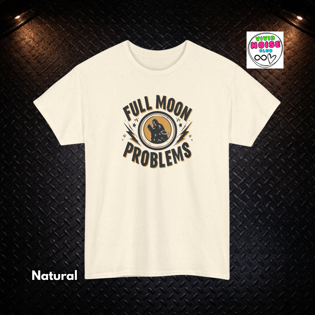 An off-white short-sleeve t-shirt with a graphic print reading 'FULL MOON PROBLEMS' around a central moon and wolf illustration, displayed against a dark textured background with 'Natural' text in the lower left and a 'Vivid Noise Club' badge in the upper right.