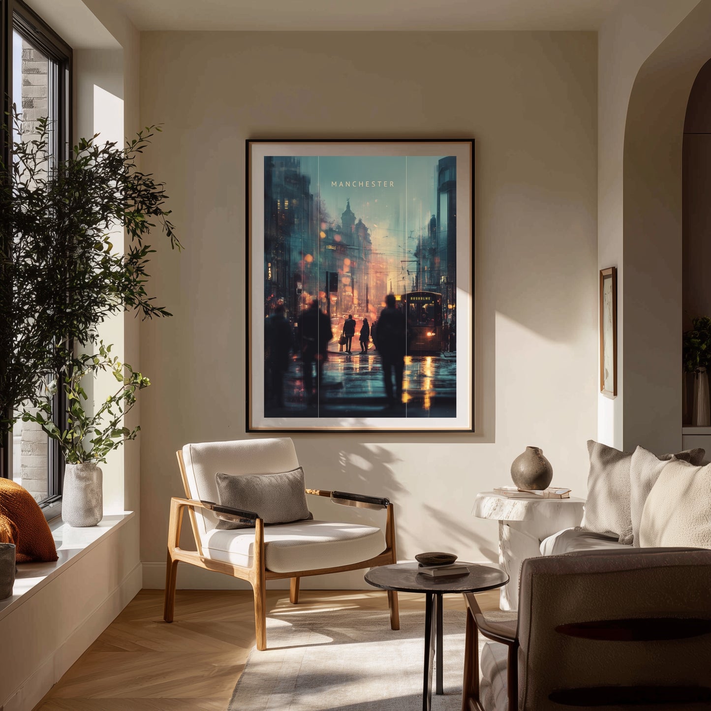 Living room with a framed Manchester artwork on the wall, chair, and sofa.