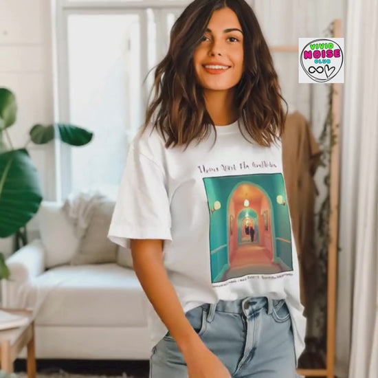 Video showing the Please Mind The Aesthetic t-shirt on a model in a bright indoor setting, featuring a colourful film-inspired front graphic.