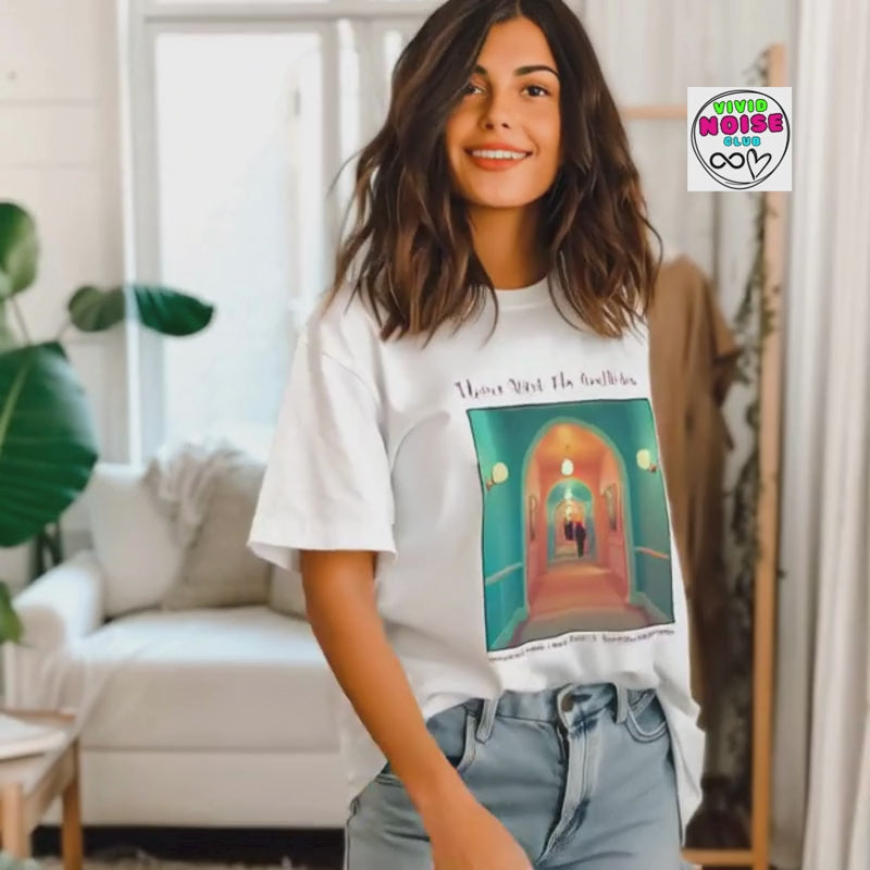 Video showing the Please Mind The Aesthetic t-shirt on a model in a bright indoor setting, featuring a colourful film-inspired front graphic.