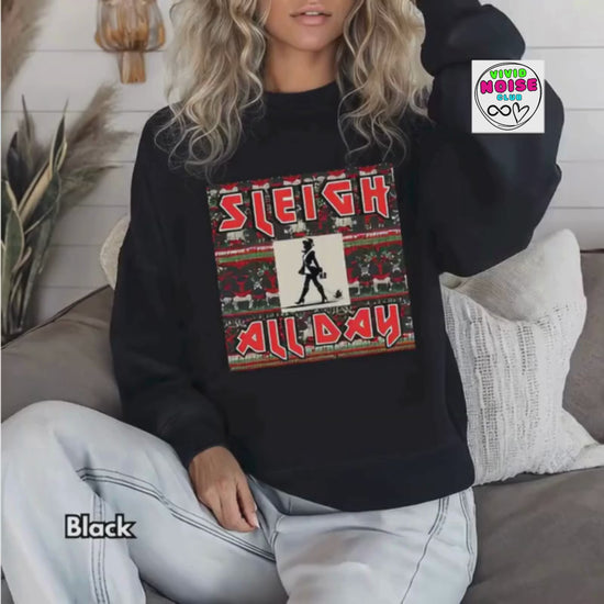 Model wearing a black Sleigh All Day Christmas sweatshirt with a bold festive pun graphic.