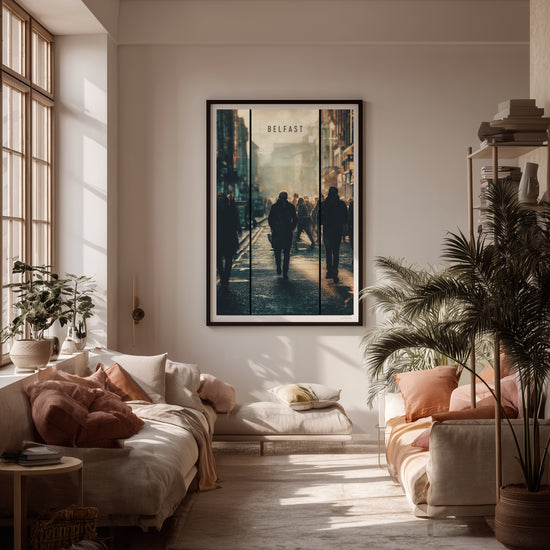 Video of living room with a large framed artwork of Belfast on the wall, featuring two people walking in a city street.