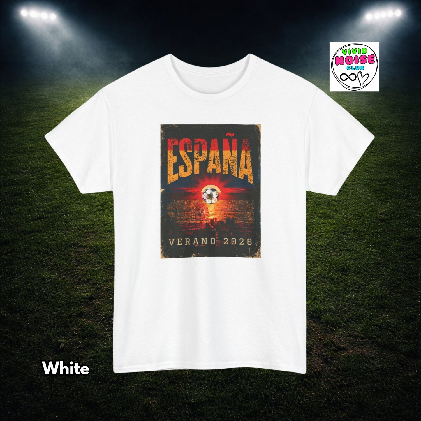 A white short-sleeve crewneck t-shirt with a rectangular graphic print on the front. The graphic features the word 'ESPAÑA' in distressed orange letters above a soccer ball and the text 'VERANO 2026' on a dark background.